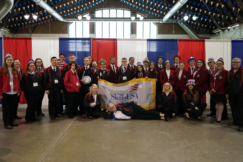 SkillsUSA students from the Sackett Center pose with banner