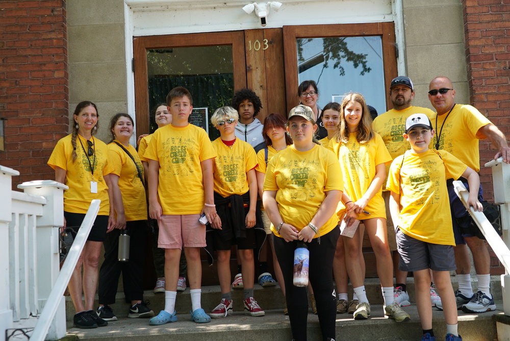 Campers and instructors outside of Sackets Harbor Ballroom 