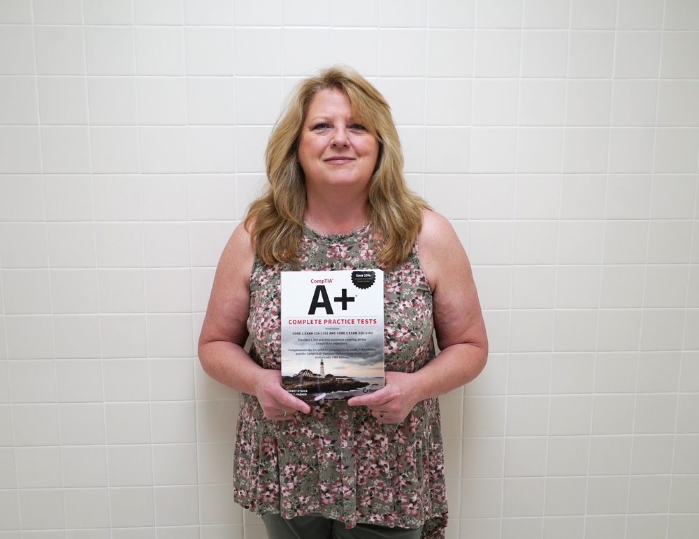 Ms. O'Shea holding new book 