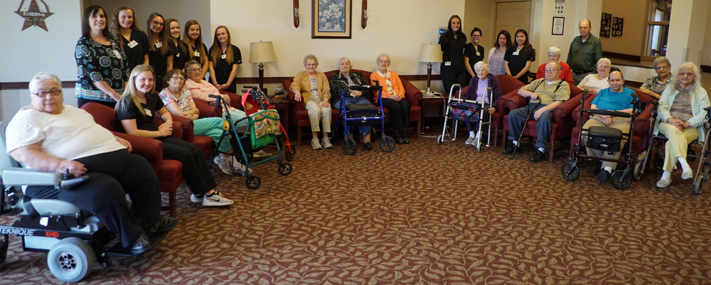 New Vision students pose with Meadowbrook residents 
