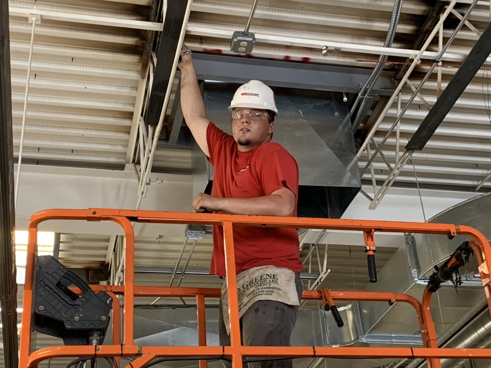 Electrican working in ceiling