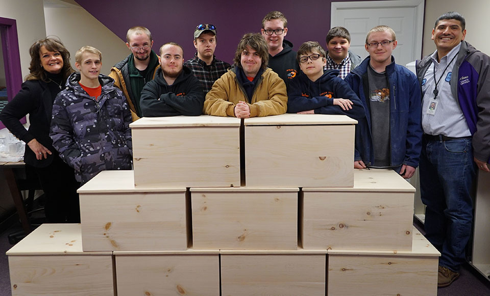 Building Projects students stand with chests