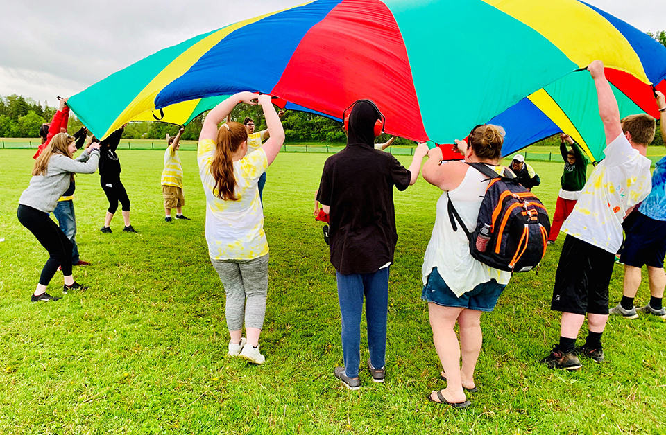 students playing with parachute 