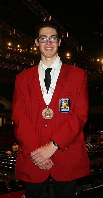 Andrew posing with medal