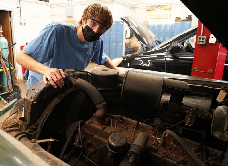 David looks under the hood of the Pontiac