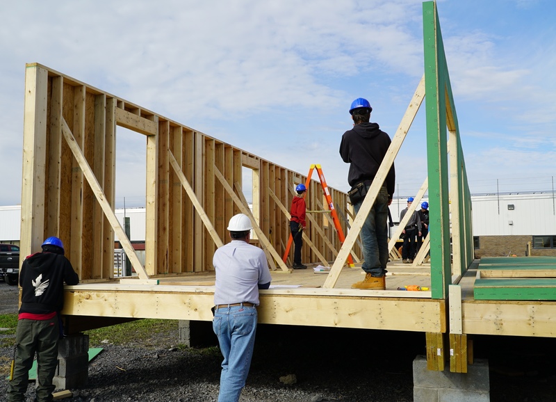 Students work on building duplex